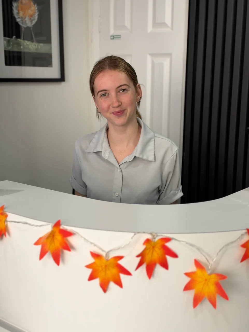 Georgie at the Signature Dentures reception desk